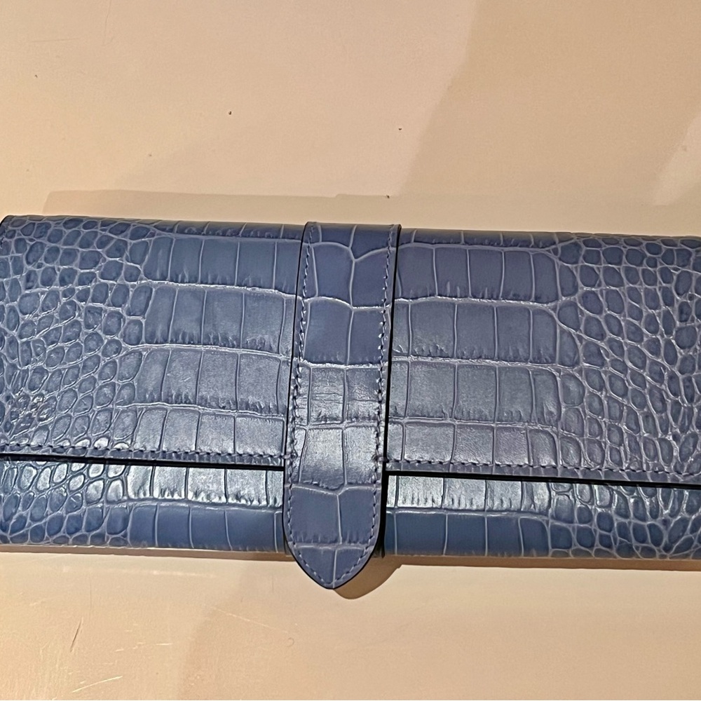 Smythson Blue Roll Travel Jewelry Bag with snap closure